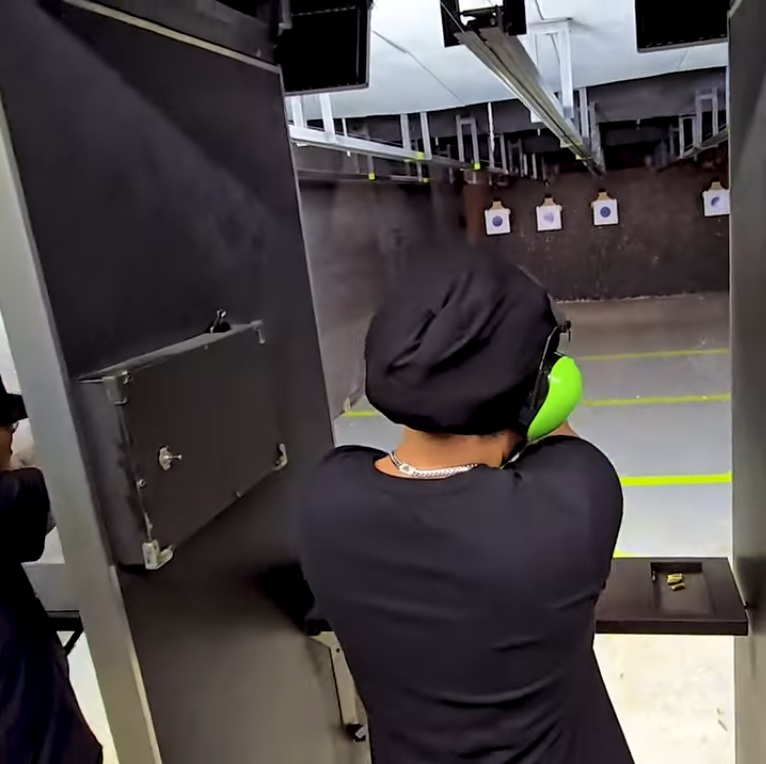 Wide-angle view of TGK's main indoor shooting range during a live training session
