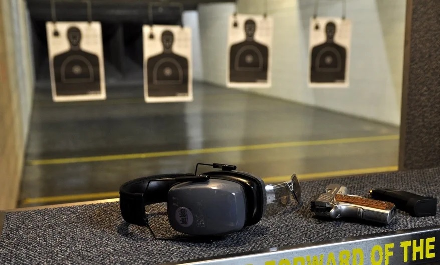 Modern TGK firearms training classroom with projector and seating